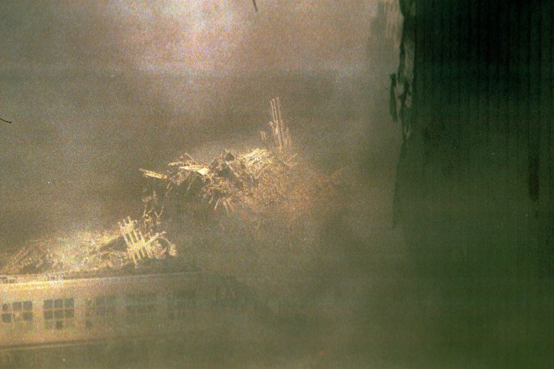 The rubble of the North Tower covers part of a pedestrian bridge at the World Trade Center on September 11, 2001.
