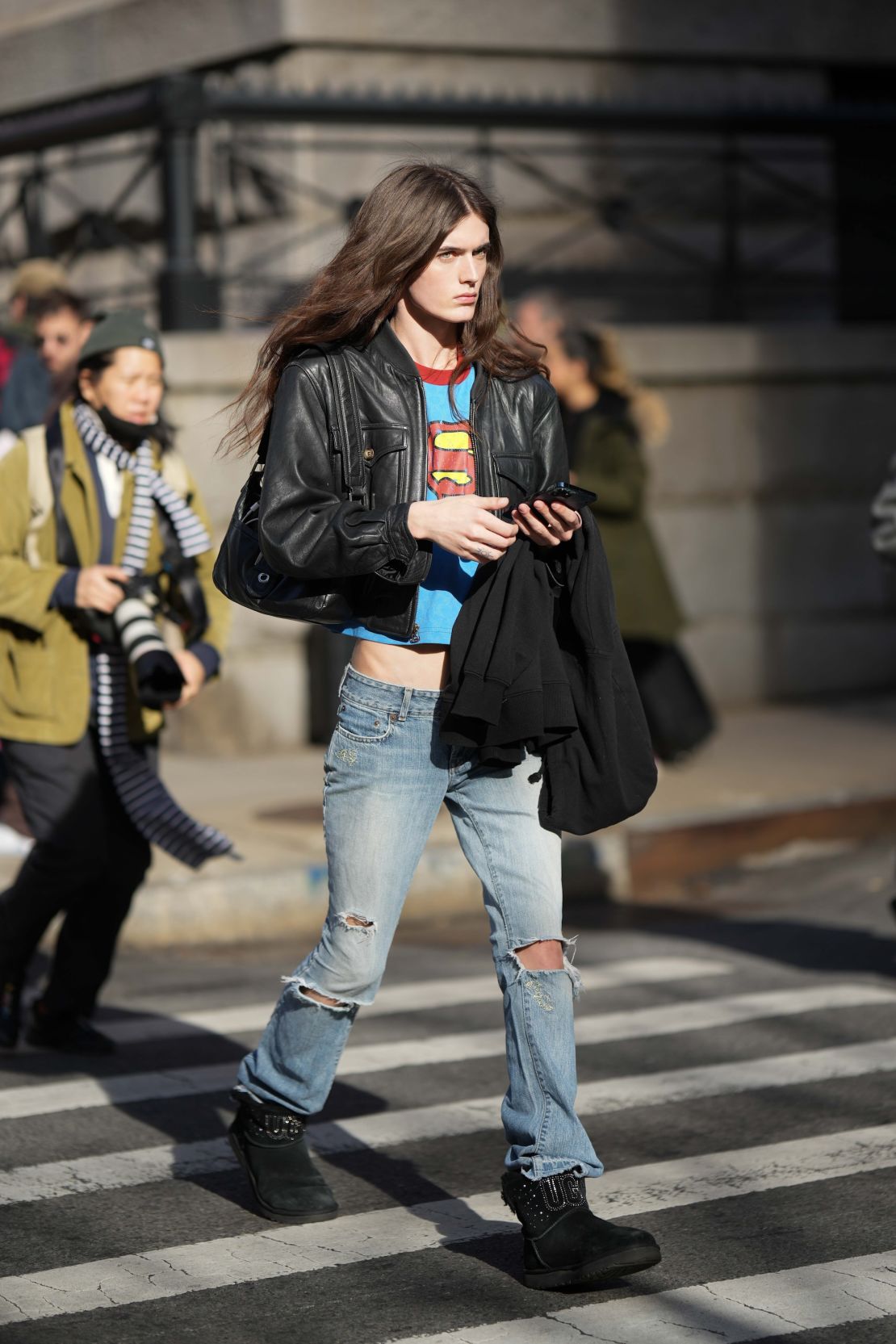 Outside Coach's Fall-Winter 2023 New York Fashion Week runway, a guest arrived in a vintage-looking Superman cropped T-shirt.