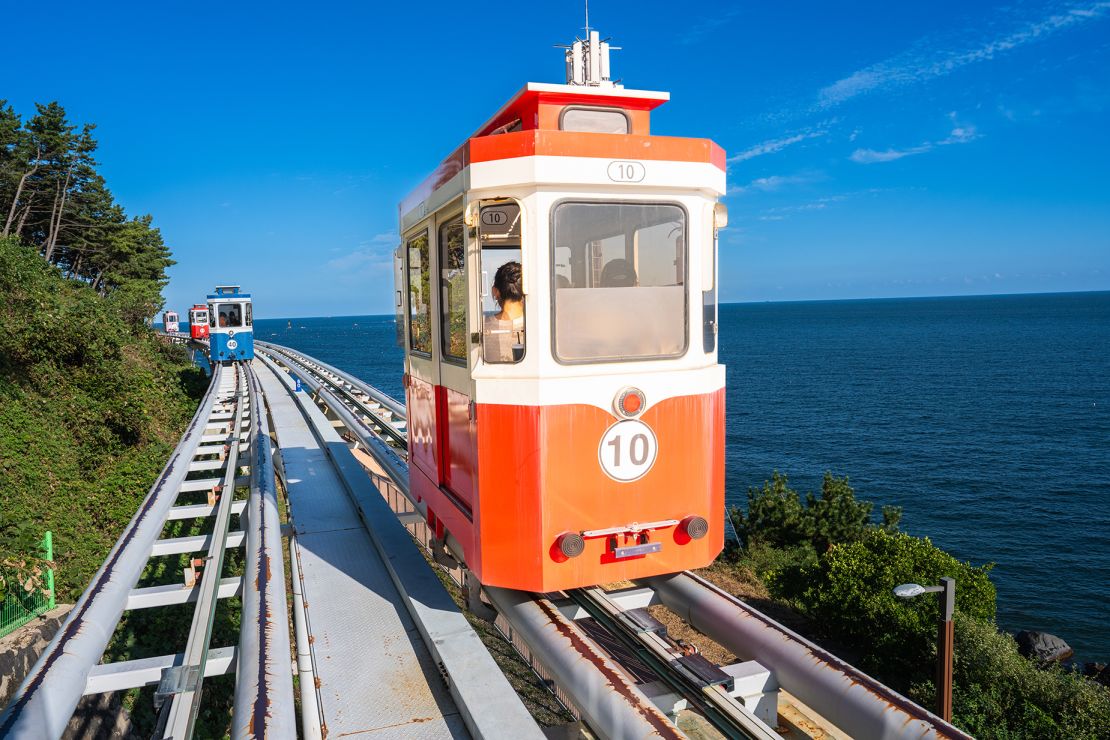 The Haeundae Sky Capsule cruises along the edge of Dalmaji Hill.