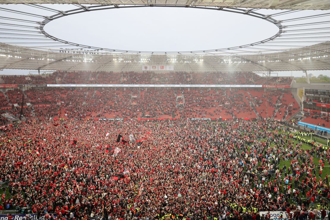 Leverkusen fans celebrated en masse on the pitch after winning the German league title.