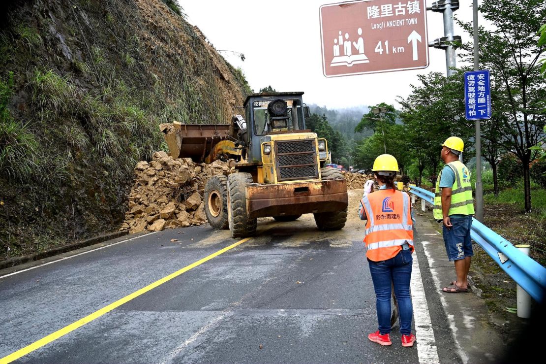 An excavator works at the site of a landslide in Guizhou province, China on June 24, 2024.