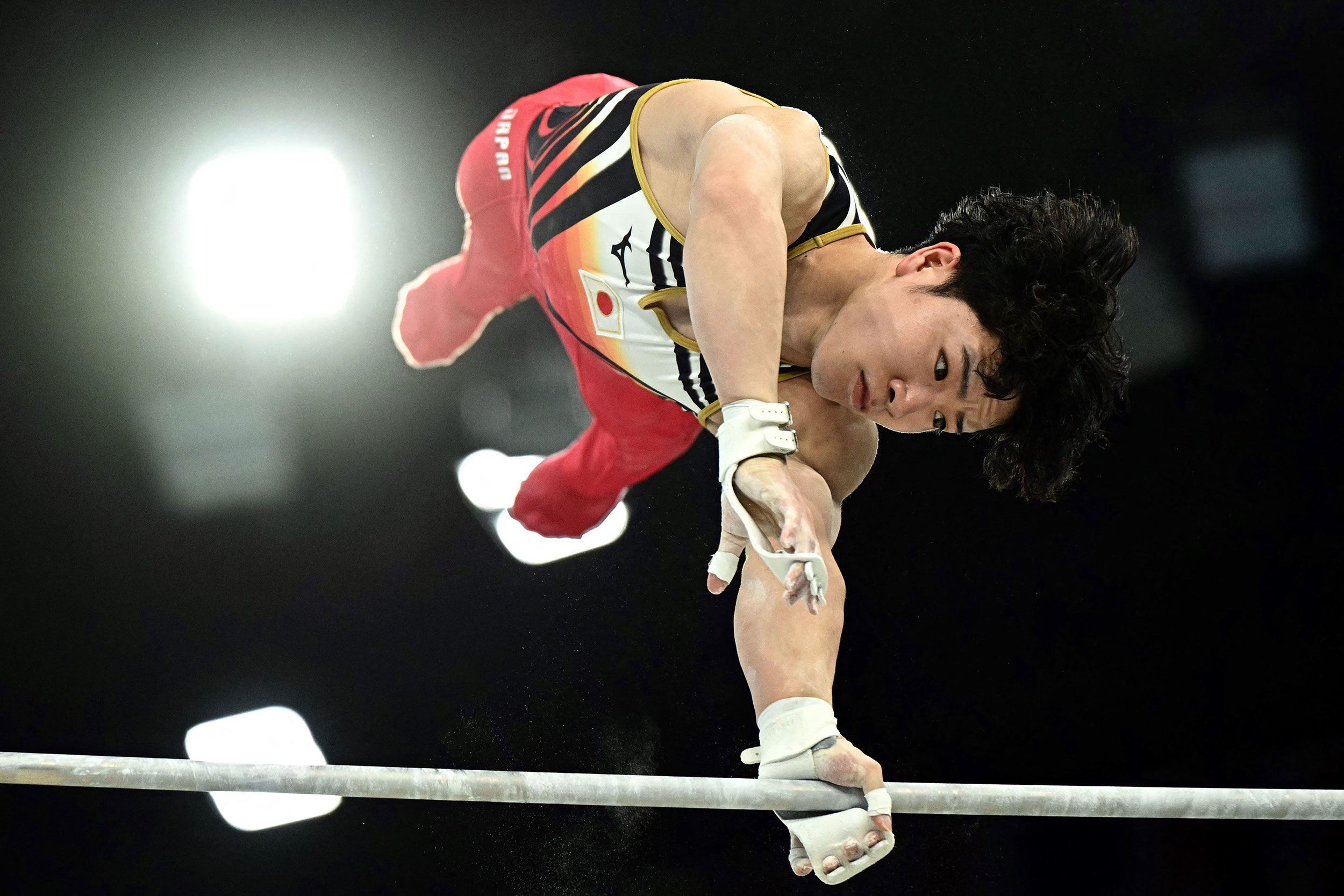 Japanese gymnast Shinnosuke Oka competes on the horizontal bar during the individual all-around on July 31. <a href="https://www.cnn.com/sport/live-news/paris-olympics-news-2024-07-31#h_637a7ecb42ecb8a0ec28ad3117455f31">Oka went on to win the gold</a>. Japanese men have now won the individual all-around in four straight Olympics. Daiki Hashimoto won three years ago in Tokyo, and Kohei Uchimura won in 2016 and 2012.