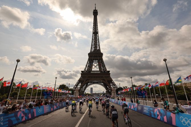 Cyclists start the men's road race at the foot of the Eiffel Tower on August 3.