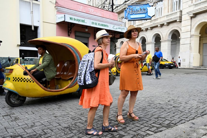 Tourists walk along a street in Havana in October 2024.