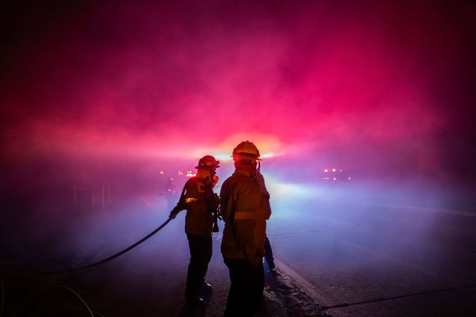 Firefighters battle the Franklin Fire on the Pacific Coast Highway near Malibu on Wednesday morning.