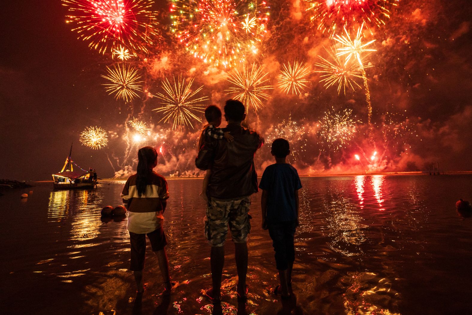 People watch New Year’s fireworks at Ancol Beach in Jakarta, Indonesia. <a href="index.php?page=&url=https%3A%2F%2Fwww.cnn.com%2F2024%2F12%2F31%2Fworld%2Fgallery%2F2025-new-year-celebrations%2Findex.html">See more celebrations from around the world</a>.