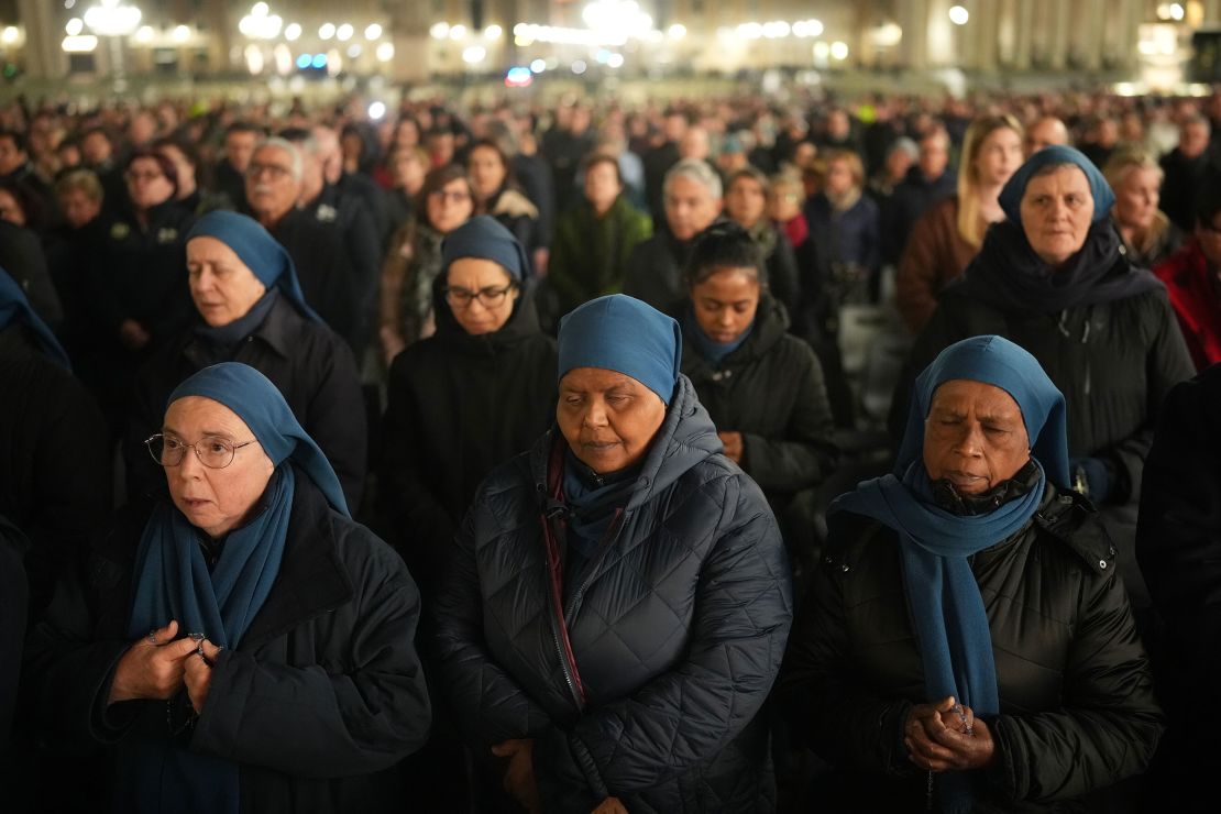 Faithful pray during the nightly Rosary prayer service for the health of Pope Francis on March 6.