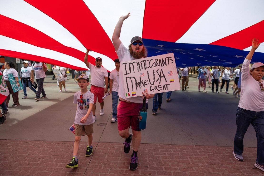 People march during the LULAC Dallas Mega March for a bipartisan immigration reform to the Dallas City Hall in Dallas on March 30.