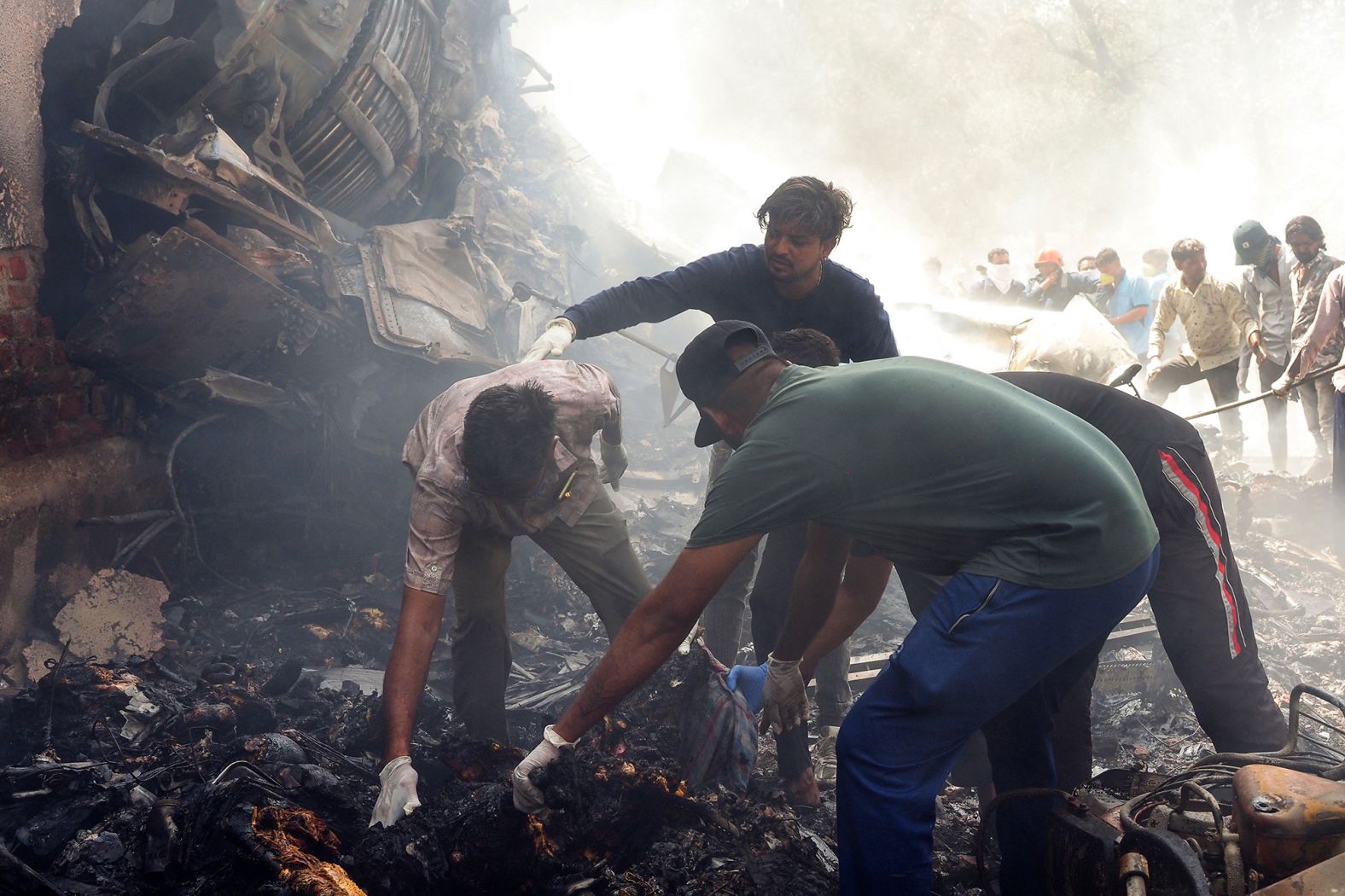 Officials work at the crash site.
