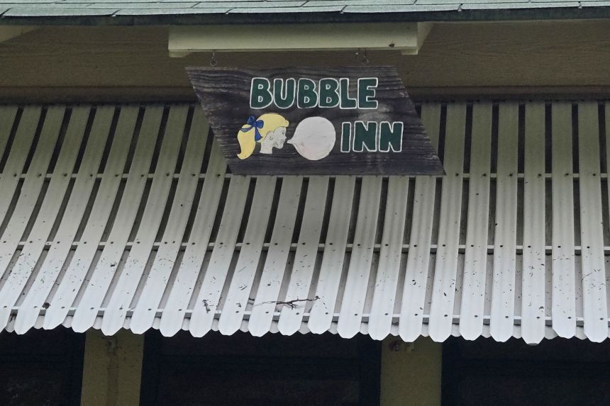 A sign hangs in front of Camp Mystic's Bubble Inn, which saw generations of girls come in.