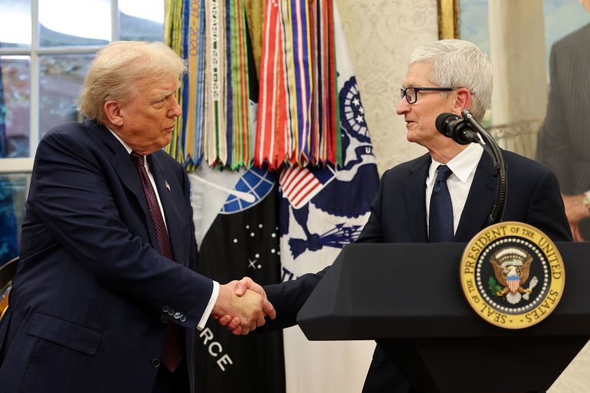 Apple CEO Tim Cook shakes hands with Trump in the Oval Office in August.