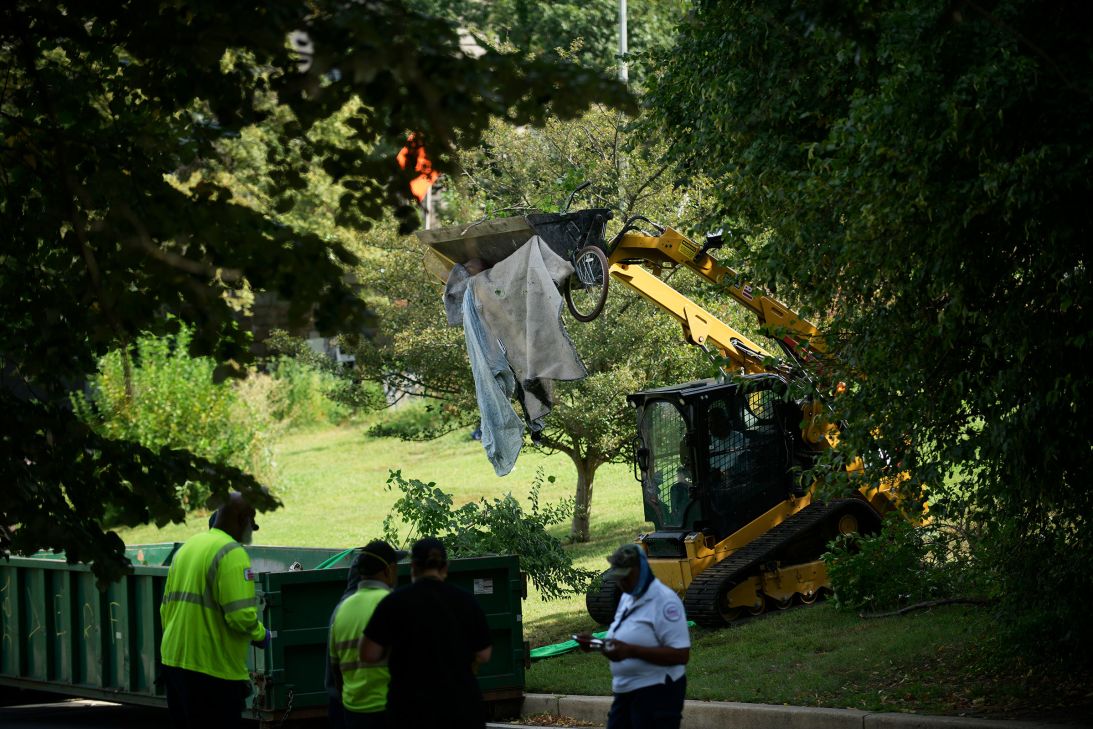 A bicycle is seen on a bulldozer, as an encampment is cleared on August 14.