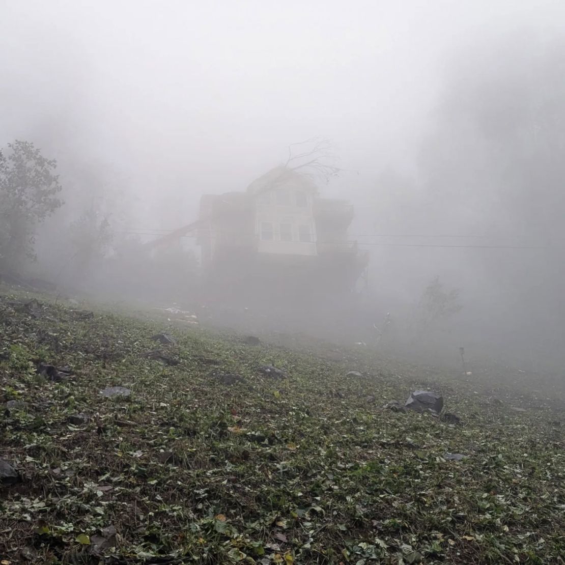 Perkins says his parents' house is on a mountain about an hour outside of Asheville.