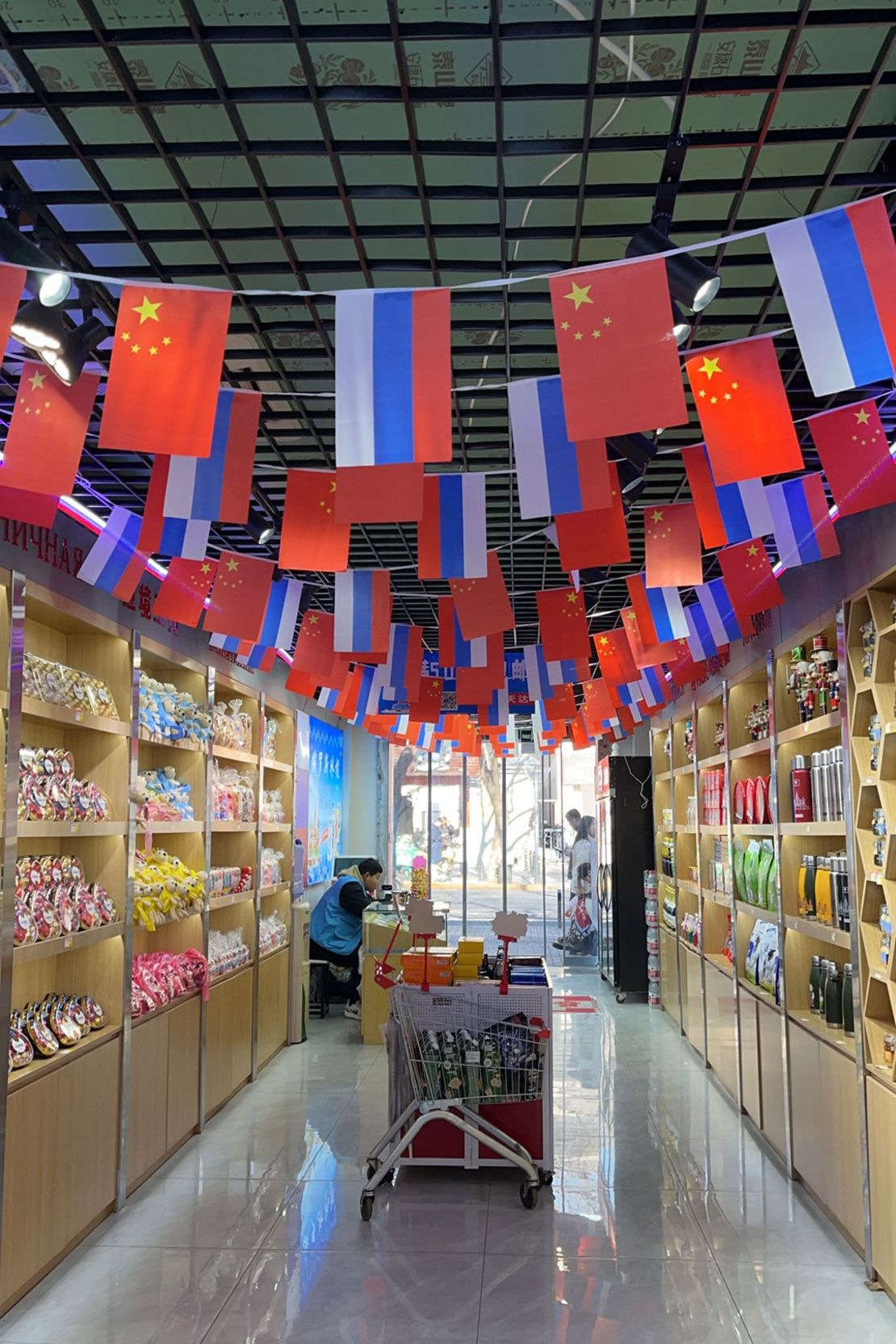 Chinese and Russian flags hang side-by-side at a store in Beijing, on February 13.