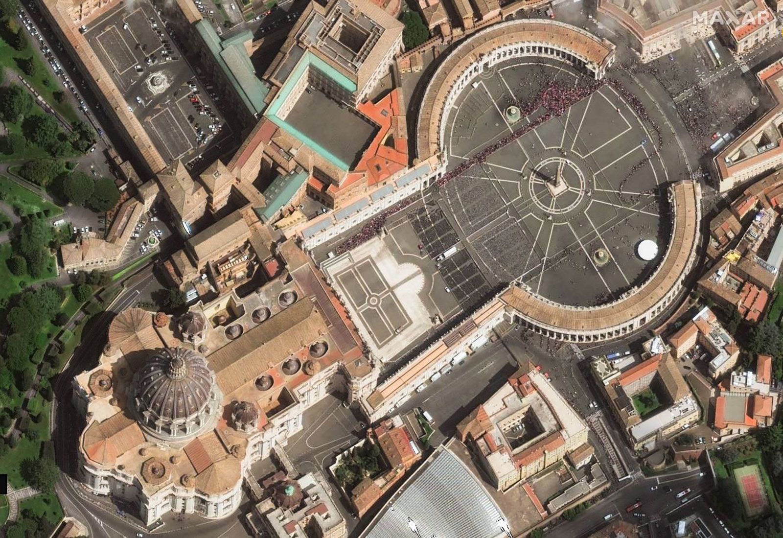 This satellite image shows long lines at St. Peter's Square as members of the public wait to enter St. Peter's Basilica.
