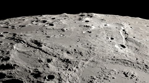 View of two grand canyons on the Moon radiating from the Schrödinger impact basin near the lunar south pole on the lunar far side.  View is from orbit looking obliquely across the surface, like an astronaut in an approaching spacecraft. 