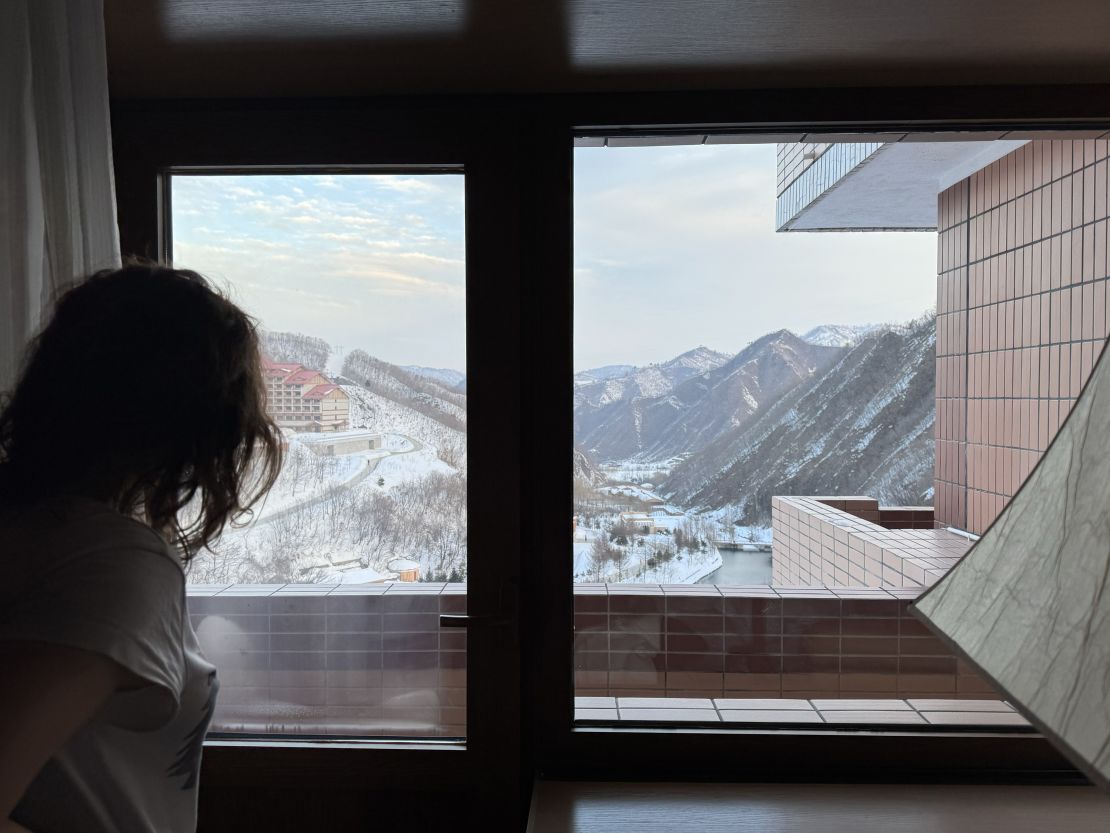 Lena Bychcova looks out the window of her room at Masikryong Ski Resort.