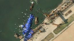 A satellite image shows what appear to be white balloons floating above the stranded North Korean warship that was damaged after a failed launch, in Chongjin, North Korea, on May 24, 2025.