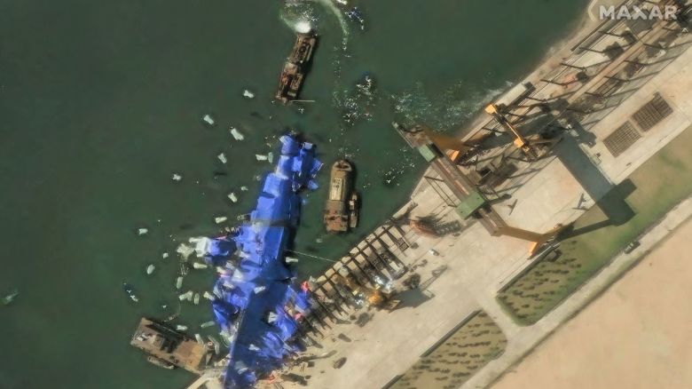 A satellite image shows what appear to be white balloons floating above the stranded North Korean warship that was damaged after a failed launch, in Chongjin, North Korea, on May 24, 2025.