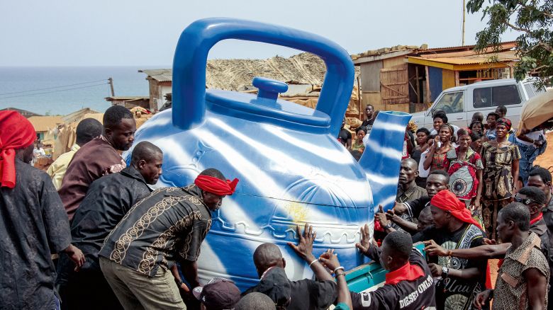 A traditional priest and fisherman was buried inside a giant blue teapot in Ghana’s Central Region in 2009. The teapot was chosen as his coffin as the priest would use a blue teapot in rituals, according to photographer and academic Regula Tschumi, who has spent decades documenting colorful funerals across Ghana.