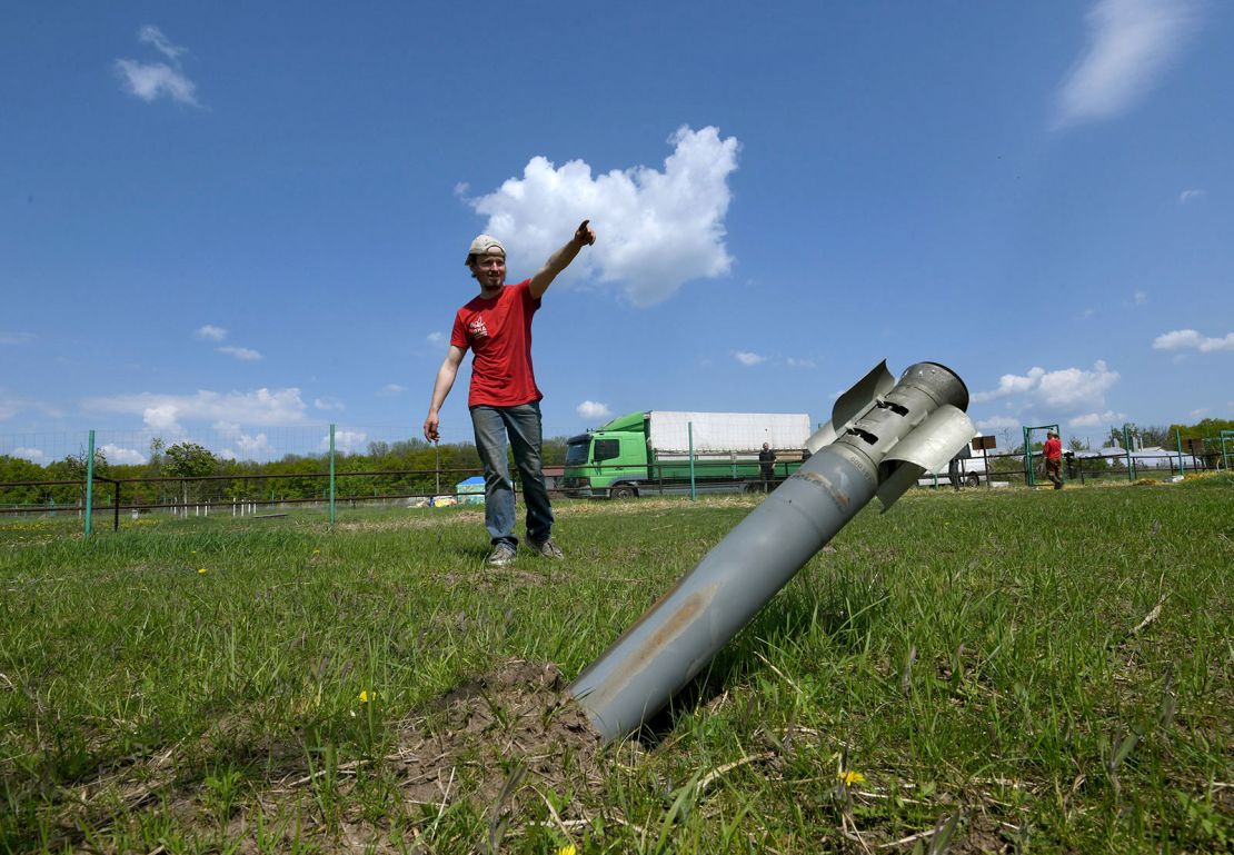 A volunteer for the animal evacuation at Feldman Ecopark helps direct the high-risk<br />rescue amidst the debris of Russian missiles in Kharkiv, Ukraine.