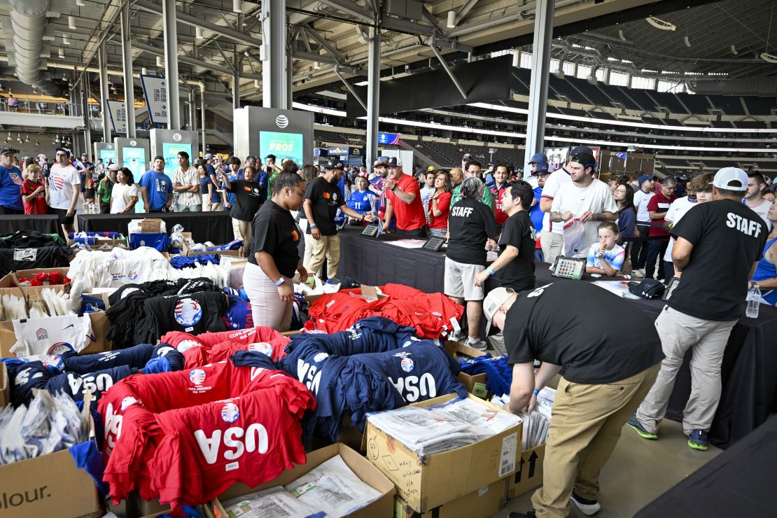 Fans buy merchandise and jerseys before the game between the United States and Bolivia on June 23.