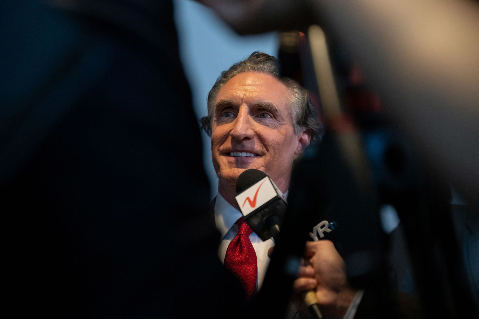 North Dakota Gov. Doug Burgum speaks to reporters at the convention on Tuesday. Burgum was one of the finalists to be Trump's running mate.