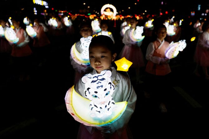 Children in Seoul, South Korea, march with lanterns Saturday, April 26, during a Lotus Lantern parade celebrating Buddha’s upcoming birthday.