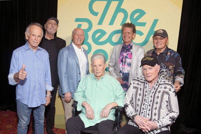 Wilson, seated at center, and other members of the Beach Boys attend the world premiere of a Beach Boys documentary in 2024.