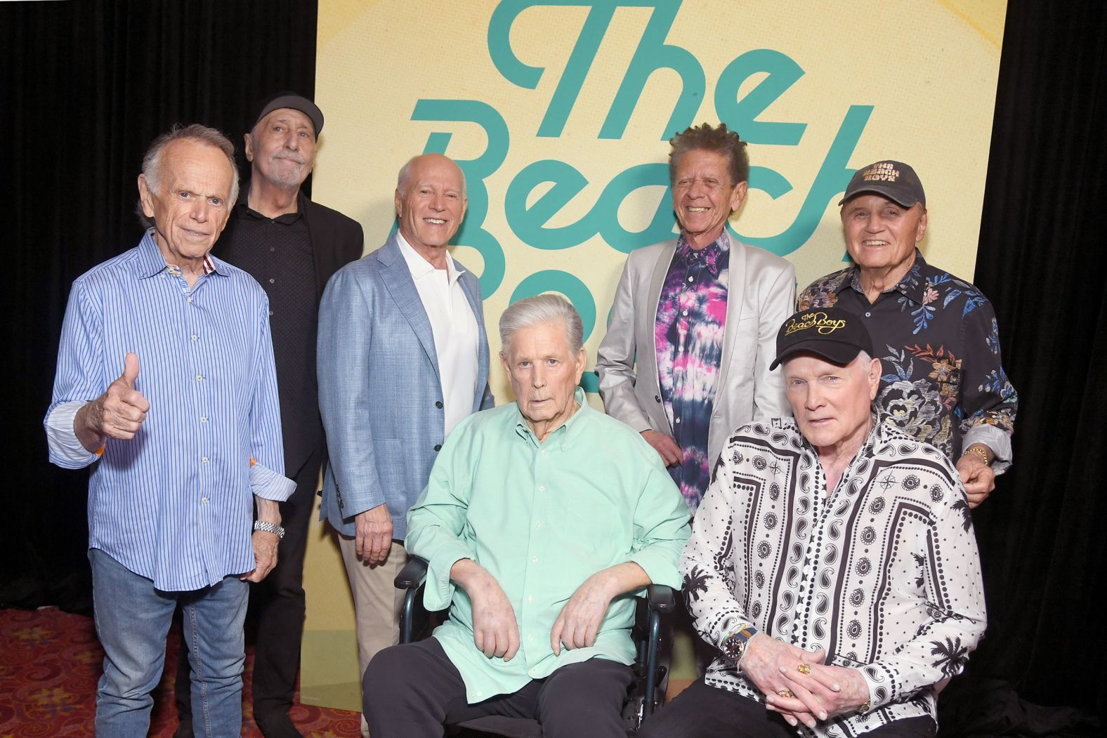 Wilson, seated at center, and other members of the Beach Boys attend the world premiere of a Beach Boys documentary in 2024.