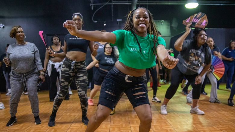 Line dance instructor Jasmine King teaches a sequence of choreographed steps to her class at Creatives Rental Space in Atlanta, Georgia, March 19, 2025.