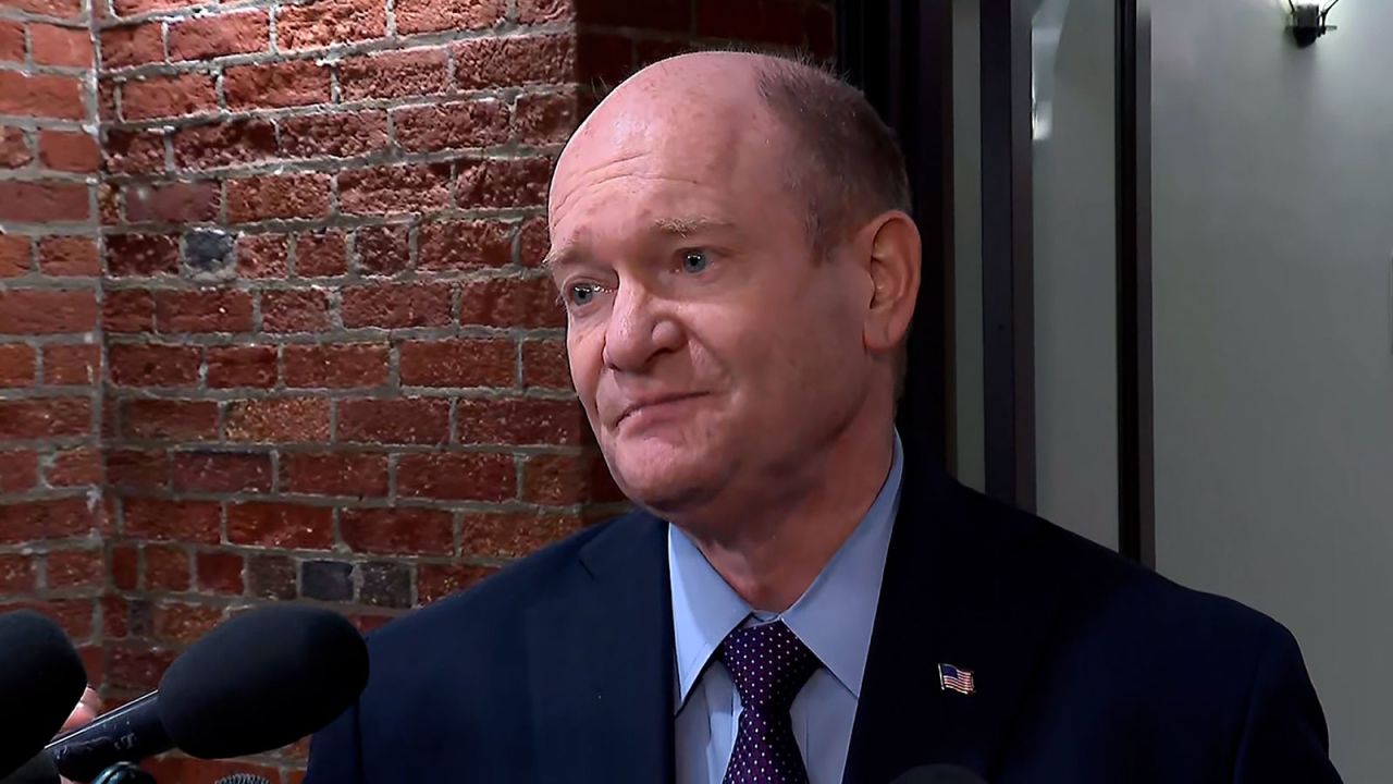 Sen Chris Coons speaks with reporters on Wednesday, September 11.