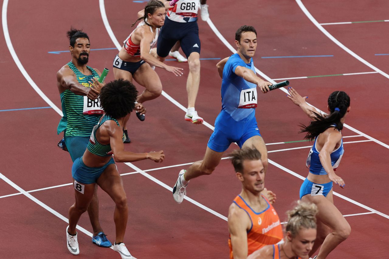Athletes from Brazil, Great Britain, Italy and Netherlands compete in the mixed 4x400-meter relay heat on July 30.