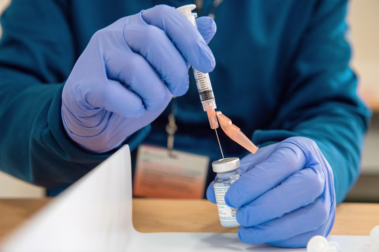 A pharmacist fills syringes with the Moderna Covid-19 vaccine at UMass Memorial hospital in Marlborough, Massachusetts, on January 12.