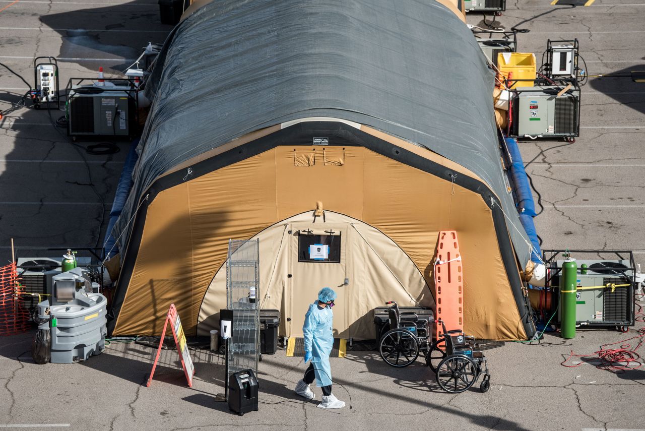 A nurse exits a tent for coronavirus patients at University Medical Center in El Paso, Texas, on October 30. Health care workers will be among the first to get the coronavirus vaccine.