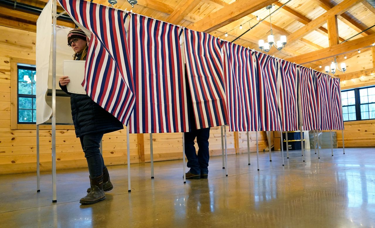 Voter leave a voting booth at The Barn at Bull Meadow in Concord, New Hampshire, during voting for the New Hampshire Primary on January 23.