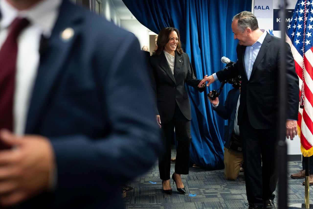 Vice President Kamala Harris, left, and second gentleman Doug Emhoff arrive to greet staff at her campaign headquarters in Wilmington, Delaware on July 22.