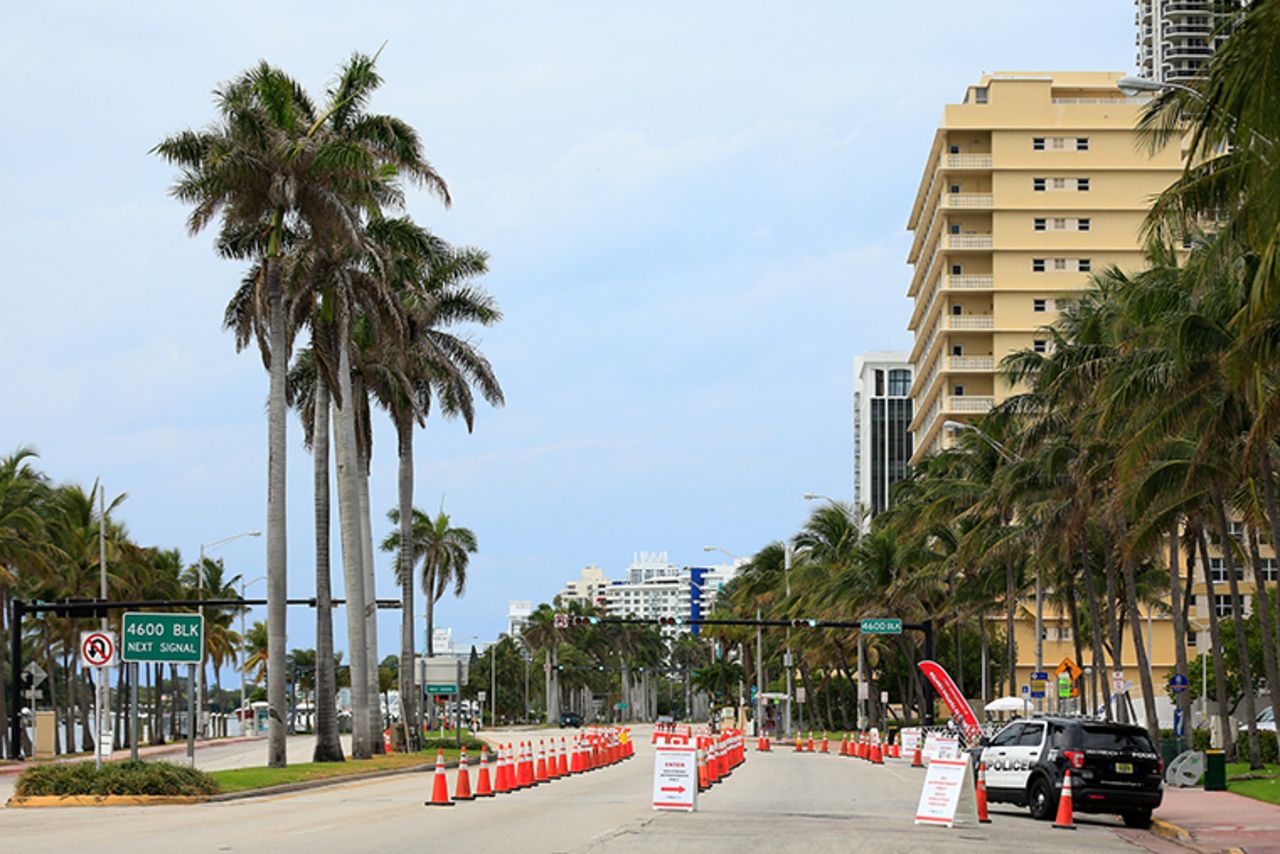 A police patrol vehicle is parked in front of the City of Miami Beach’s municipal parking lot which houses a MedRite COVID-19 testing site on April 05, 2020 in Miami Beach, Florida.