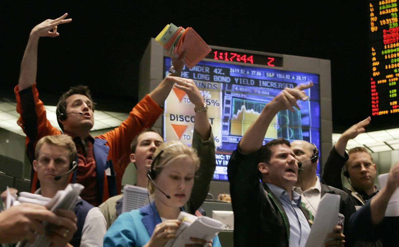 Traders in the Chicago Board of Trade's two- and five-year options market place orders in Chicago, Illinois, on Tuesday, September 18, 2007. The Federal Reserve cut its key interest rate by half a point to 4.75 percent, the first cut in four years, in hopes of preventing the U.S. from sliding into a recession caused by the fallout from the housing market. 