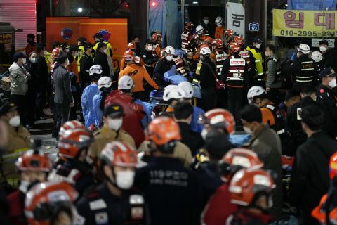 Rescue workers on the street near the scene in Itaewon on Saturday night.