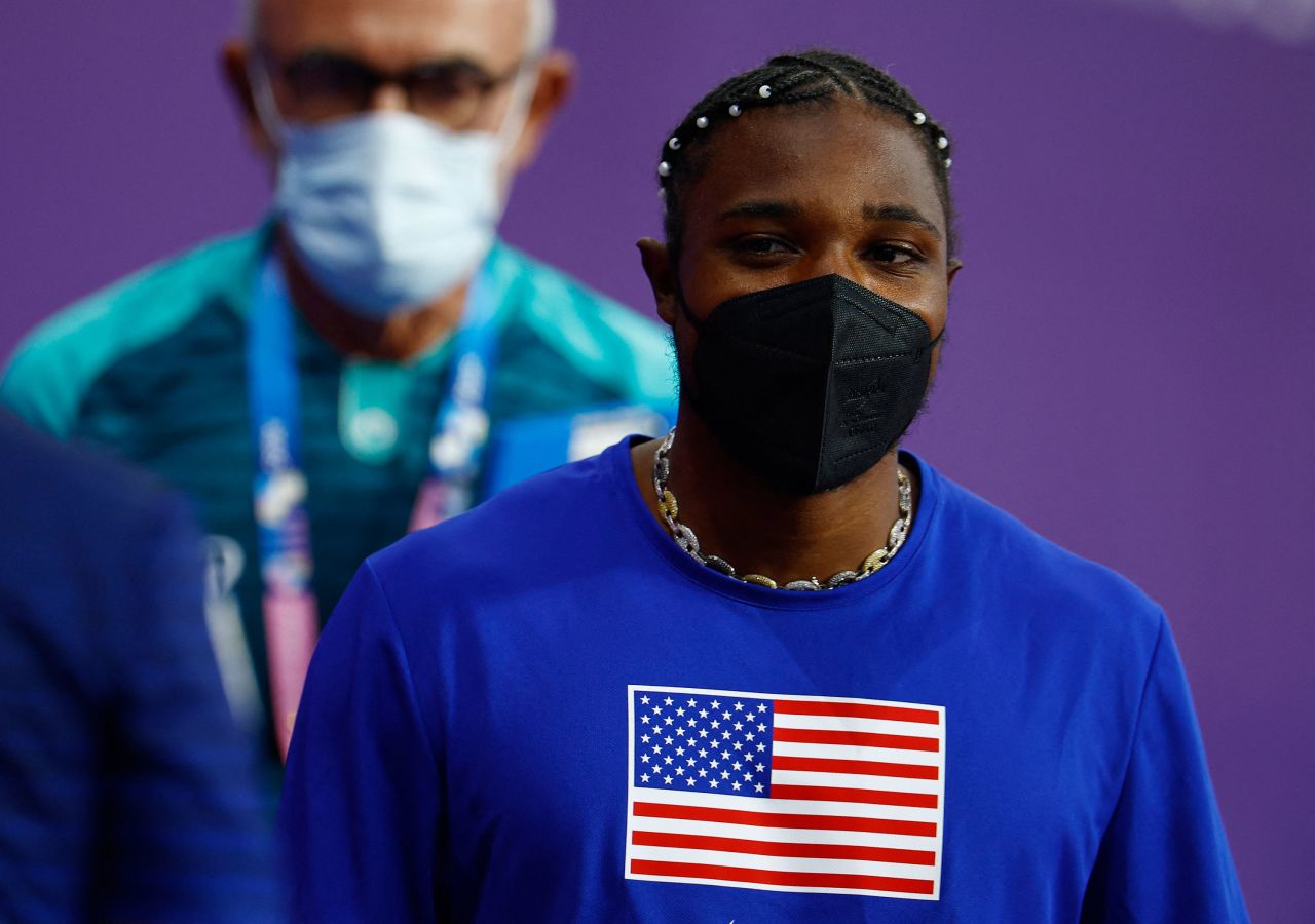 Noah Lyles is seen in a protective face mask after receiving medical attention after the men's 200m final on Thursday.