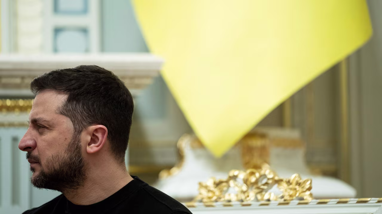 Ukrainian President Volodymyr Zelensky listens as US President Joe Biden speaks at Mariinsky Palace during a surprise visit, on February 20 in Kyiv. 