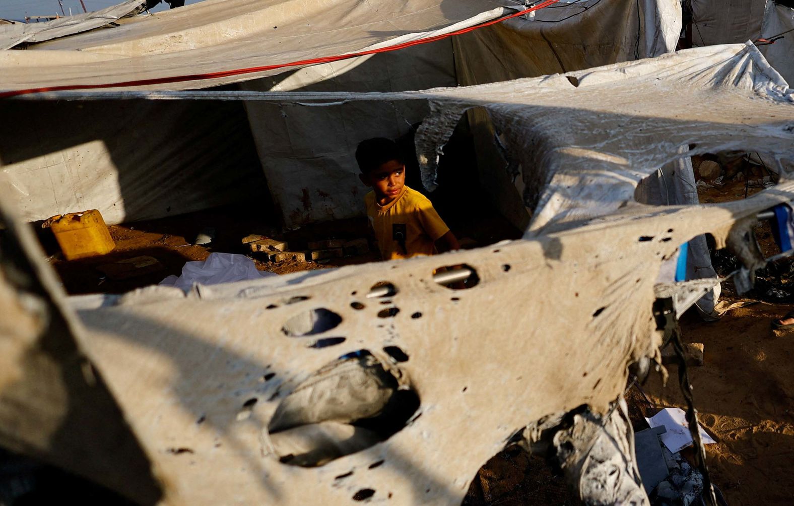 A child looks out from a tent on Monday, September 8, after an overnight Israeli airstrike in Gaza City. The next day, <a href="index.php?page=&url=https%3A%2F%2Fwww.cnn.com%2F2025%2F09%2F09%2Fmiddleeast%2Fisrael-gaza-city-evacuation-netanyahu-warning-intl">Israel ordered a complete evacuation of Gaza City</a> ahead of its controversial military takeover.