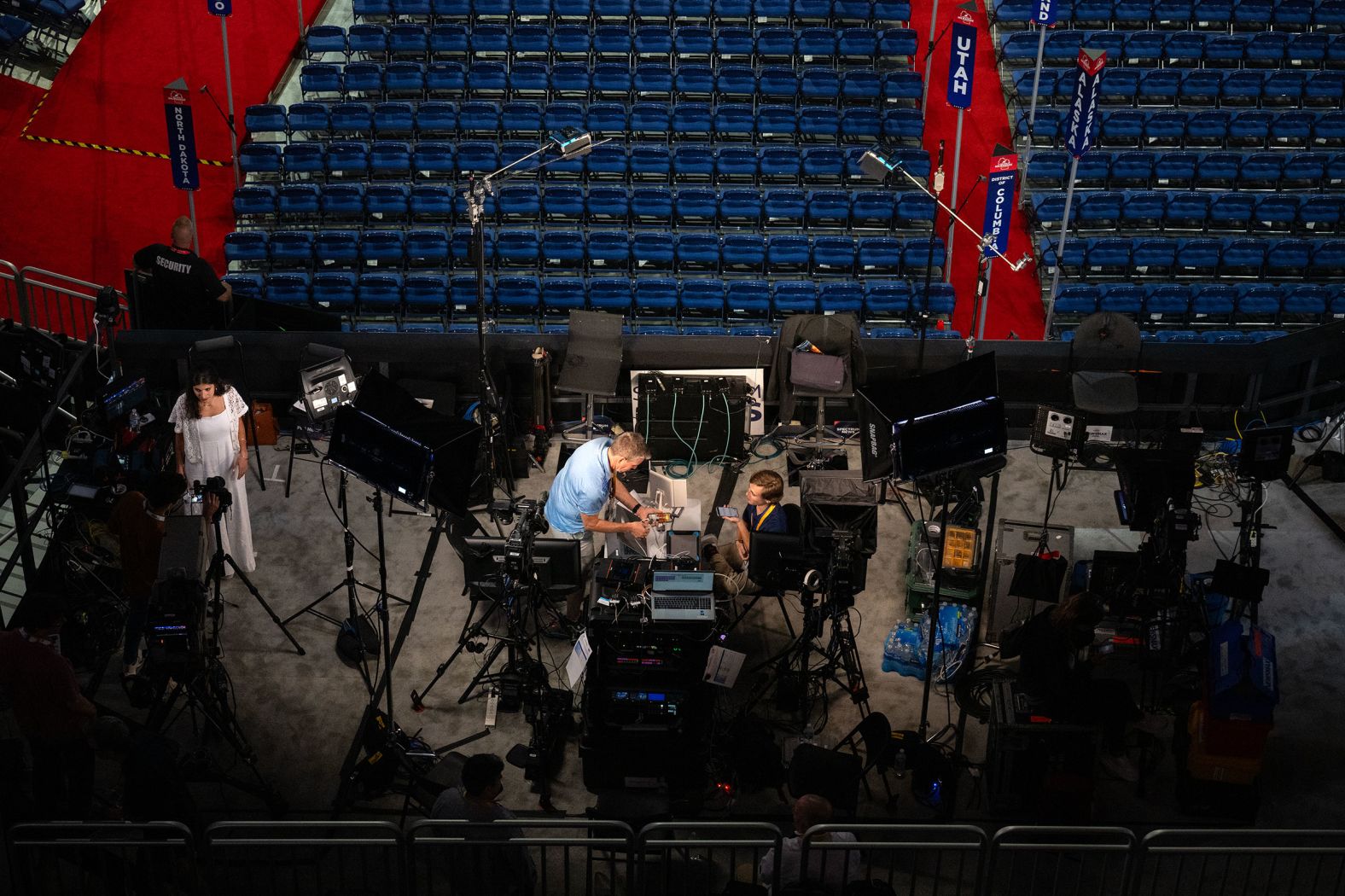 Members of the media work inside the arena on Sunday.