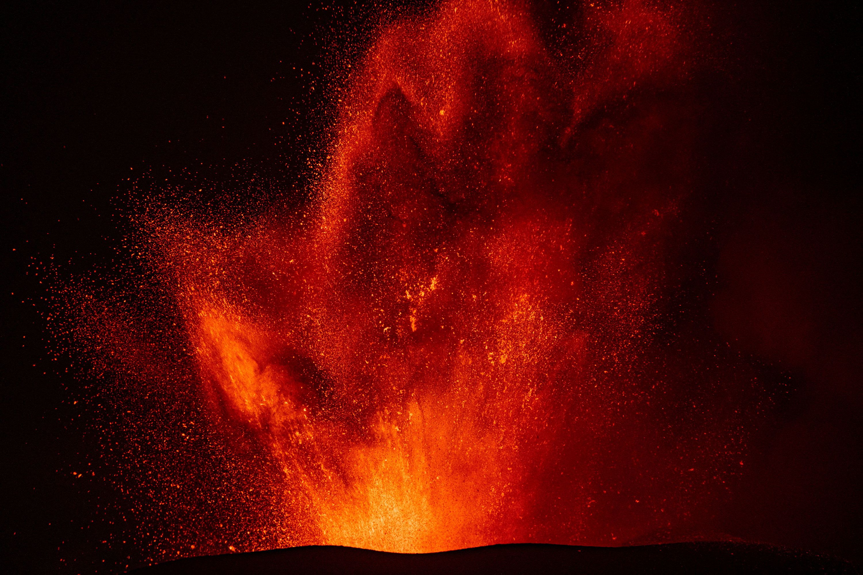 Lava rises from a crater of Mount Etna.