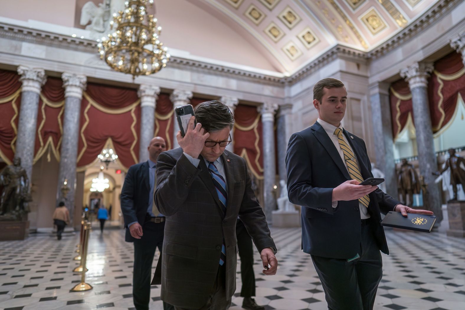 House Speaker Mike Johnson, center, walks through the US Capitol’s Statuary Hall as lawmakers gathered to vote in the House chamber on Tuesday, February 6. <a href="index.php?page=&url=https%3A%2F%2Fwww.cnn.com%2F2024%2F02%2F06%2Fpolitics%2Fhouse-vote-mayorkas-impeachment%2Findex.html">The vote to impeach Homeland Security Secretary Alejandro Mayorkas failed</a> as three Republicans joined Democrats in voting “no.” It was a stunning blow to House Republicans who had pushed the effort as a key political goal.