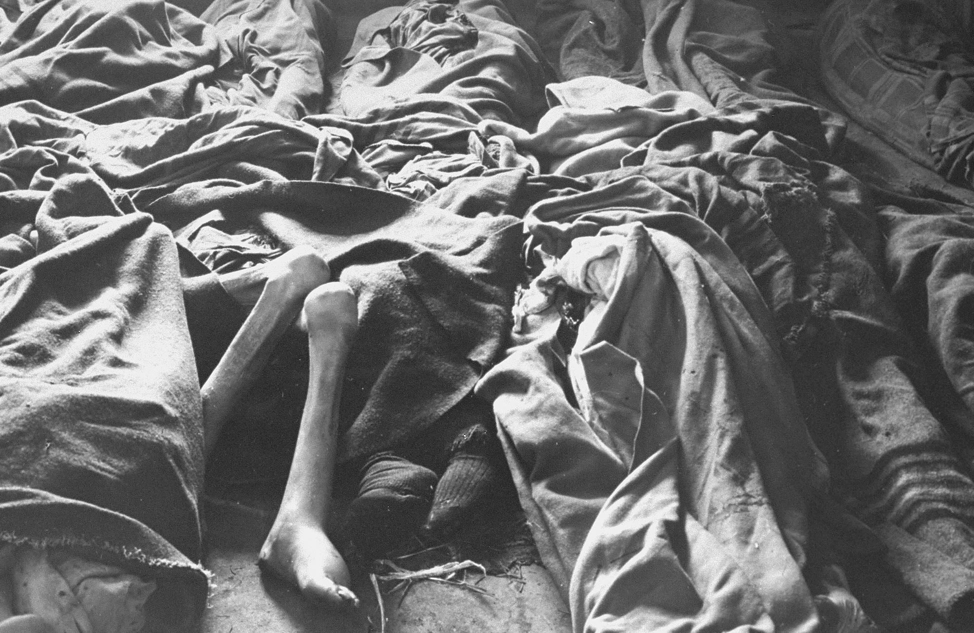 Corpses of women are piled up on the floor in February 1945.