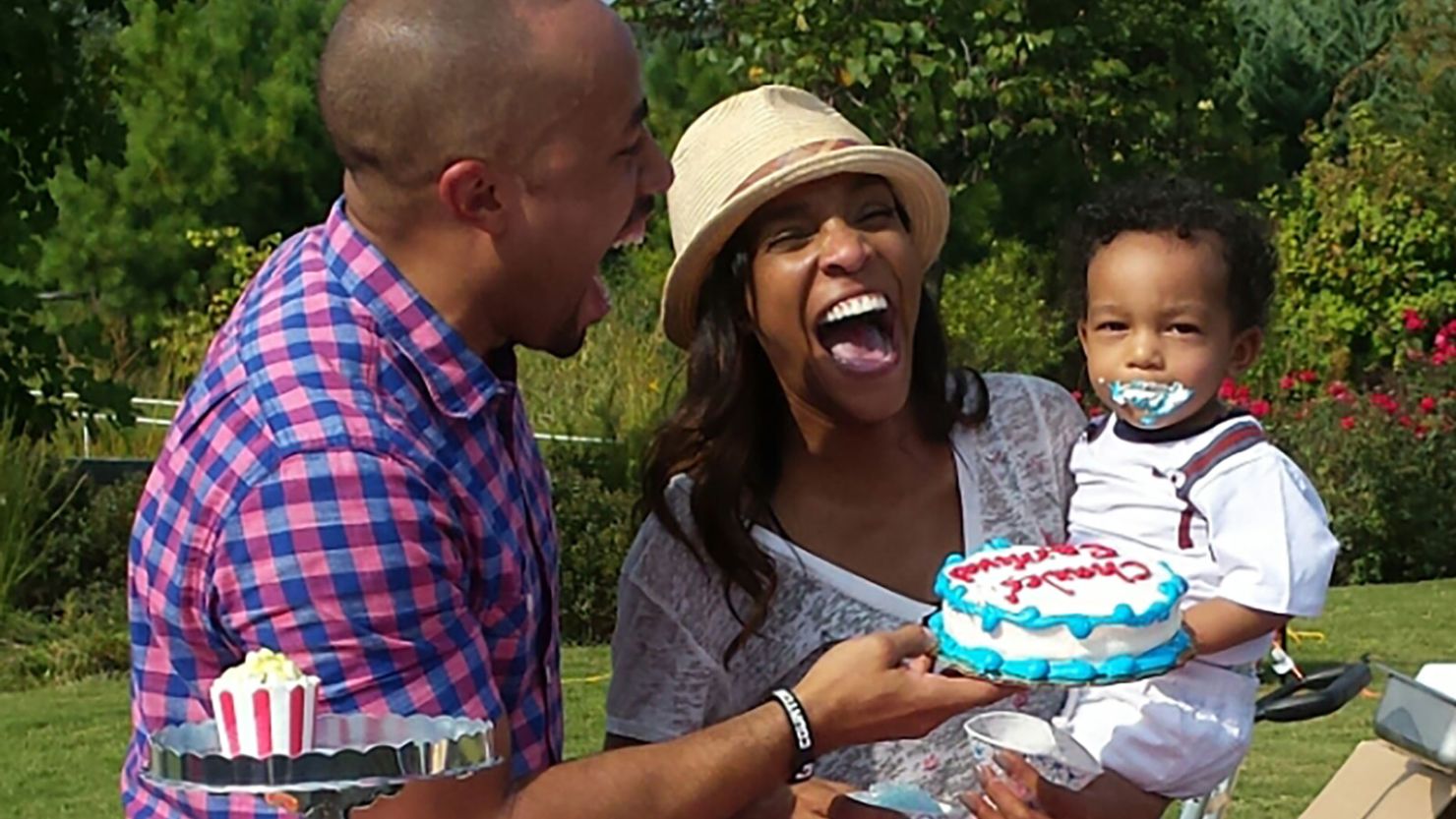 Kira and Charles Johnson celebrating their eldest son's first birthday.