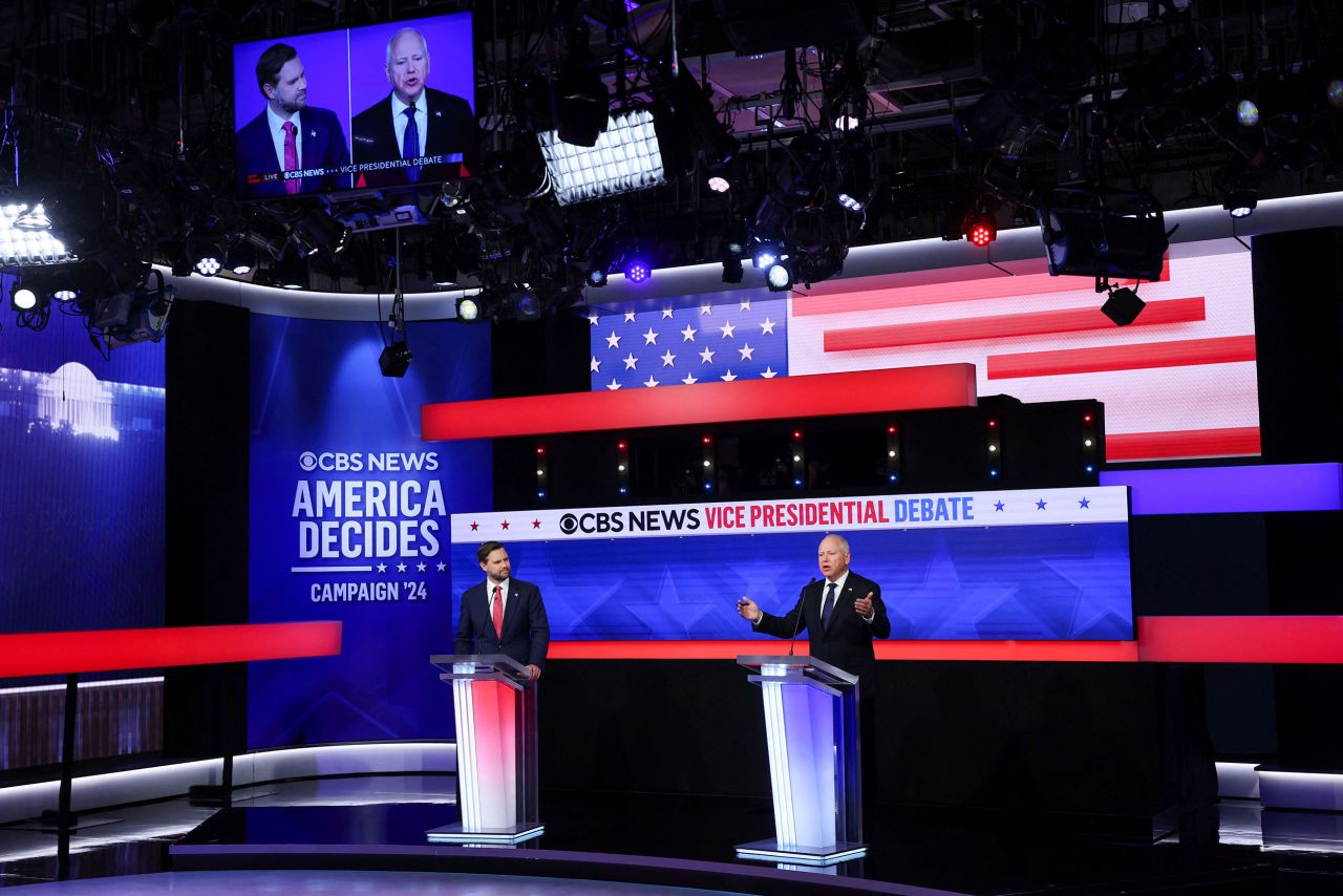 Gov. Tim Walz speaks during the vice presidential debate as Sen. JD Vance listens in New York on Tuesday.