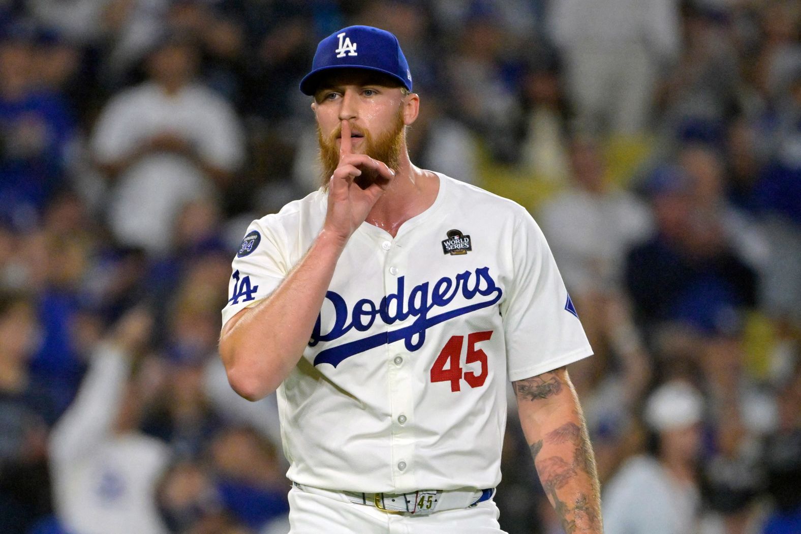 Dodgers pitcher Michael Kopech shushes the Yankees dugout during the eighth inning of Game 2.